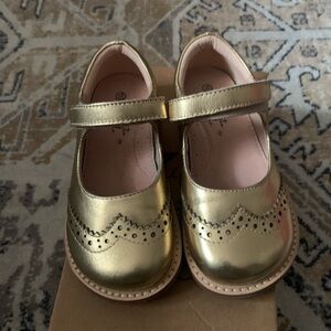 Beautiful gold leather Mary Janes with a cushioned insole